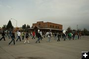 Marching across Pine Street. Photo by Dawn Ballou, Pinedale Online.