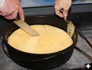 Cutting cornbread. Photo by Dawn Ballou, Pinedale Online.