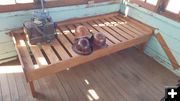 Bed and artifacts. Photo by Clint Gilchrist, Sublette County Historic Preservation Board.